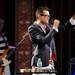 Andrew Mayer Cohen, the lead singer of Mayer Hawthorne, holds up his hand to silence the band for a moment during the show. Angela J. Cesere | AnnArbor.com 